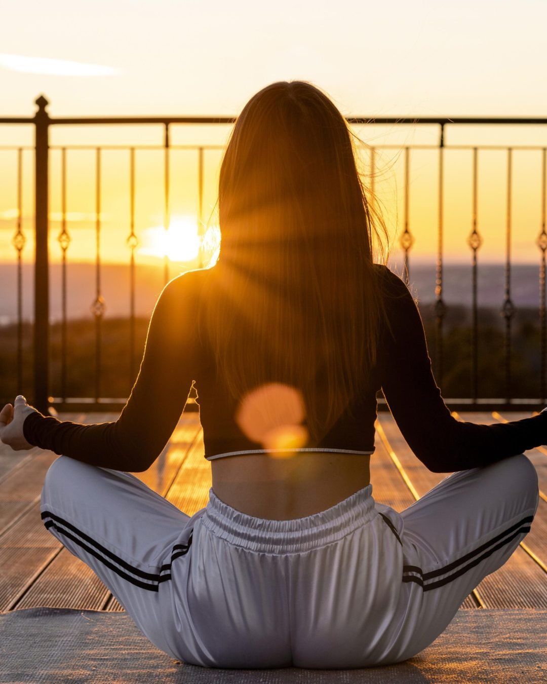 full-shot-woman-meditating-sunset-scaled-1.jpg